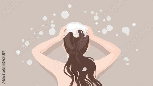 Young woman washing her hair with shampoo on light