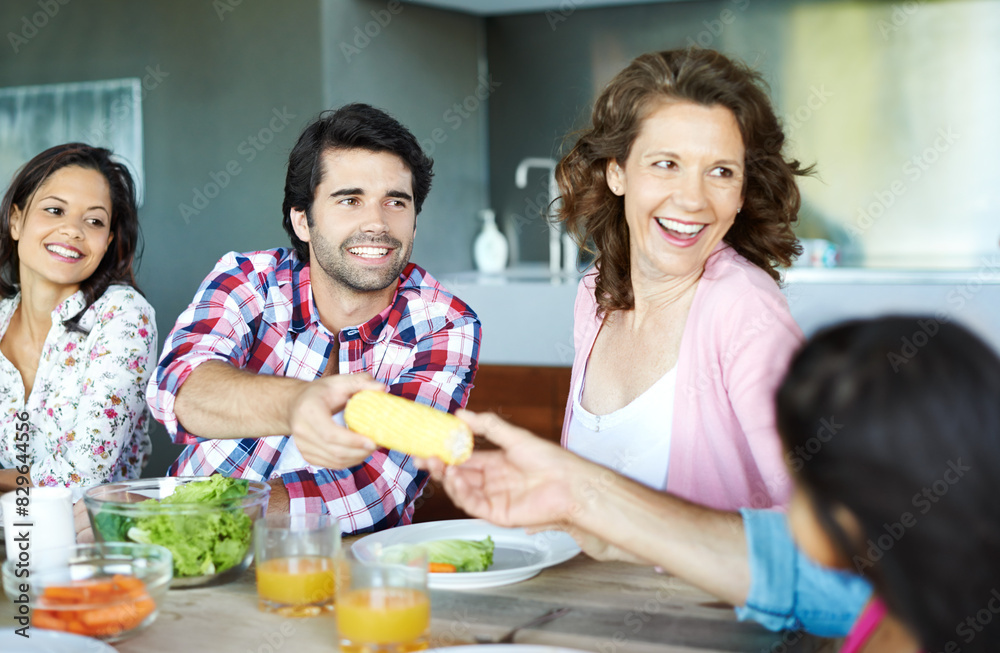 Happy, family and healthy brunch at table together for wellness, corn and juice for nutrition. Diversity, Man and woman with child in home or happy for diet with fresh salad, eating with smile Happy, family and healthy brunch at table together for wellness, corn and juice for nutrition. Diversity, Man and woman with child in home or happy for diet with fresh salad, eating with smile