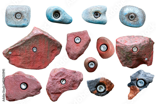 Set of grips different colors and shapes for climbing wall isolated on white background. set collection of various climbing holds with clipping path. bouldering extreme sport	
