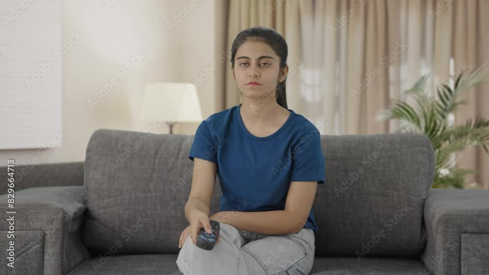 Indian teenage girl watching TV Indian teenage girl watching TV
