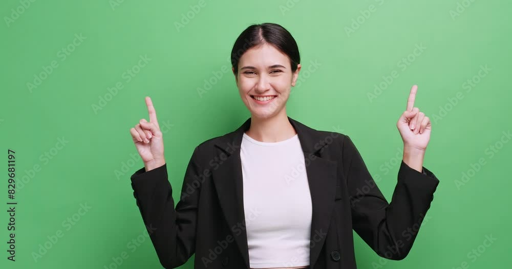 young business woman showing something or copy space for product or sign text. Isolated on green background in studio. young business woman showing something or copy space for product or sign text. Isolated on green background in studio.