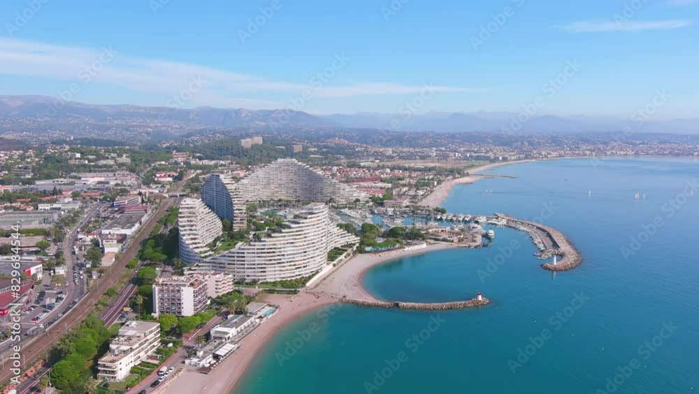 Nice, France: Aerial view of Marina Baie des Anges with yachts and boats in famous resort city by Mediterranean Sea on French Riviera - landscape panorama of Europe from above
