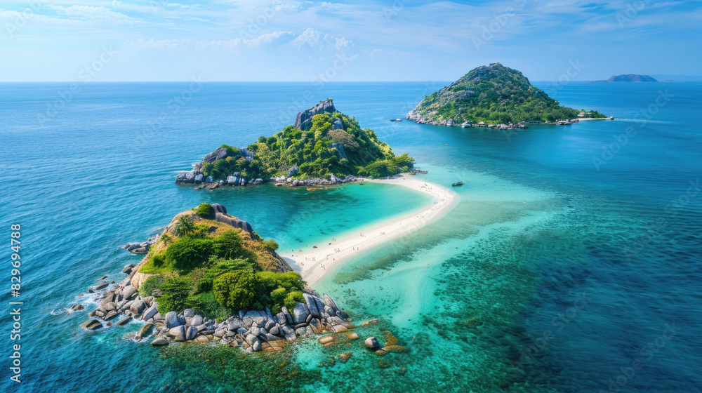 A solitary island stands surrounded by a vast ocean, offering a stark contrast between land and sea A solitary island stands surrounded by a vast ocean, offering a stark contrast between land and sea
