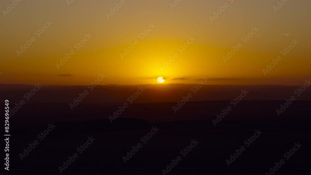 ORANGE SUNSET AT HUACACHINA DESERT PERU aerial ORANGE SUNSET AT HUACACHINA DESERT PERU aerial