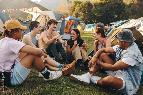 Group of friends gathering and having drinks together, creating lasting memories of an unforgettable festival experience photo