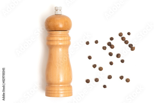 Wooden pepper mill on a white background. Cooking concept, top view