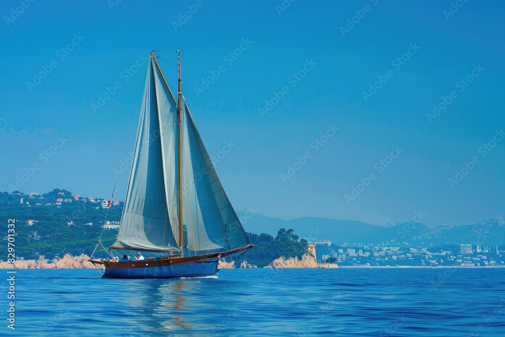Blue Sailboat on Mediterranean Seas. Day for Boating Adventure in Colorful Background