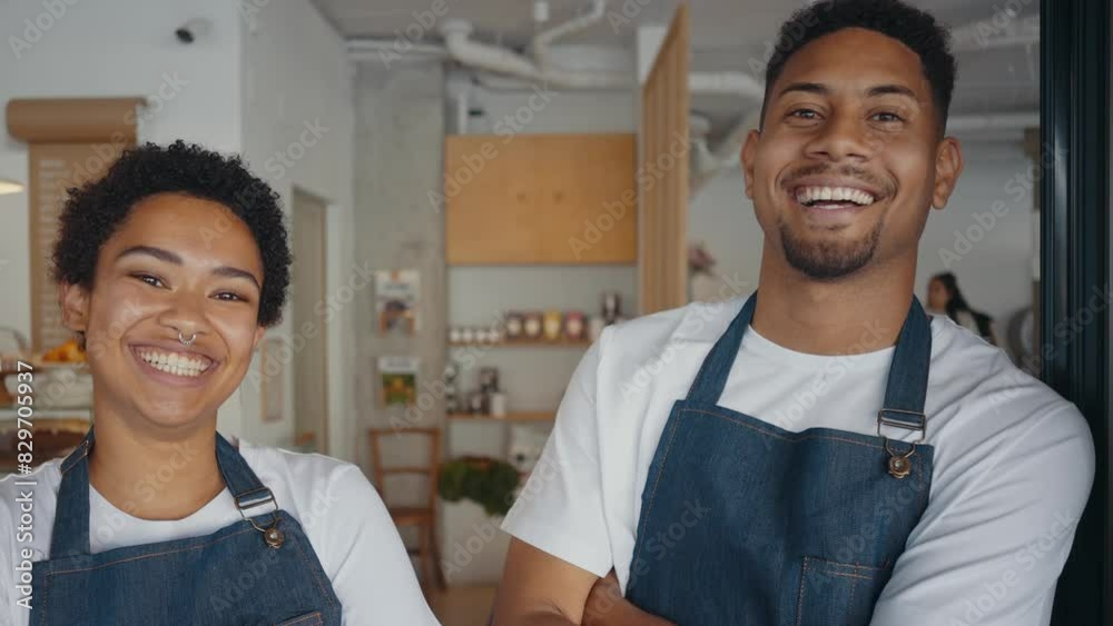 Cinematic image of employees working in a nordic styled cafe. Cinematic image of employees working in a nordic styled cafe.