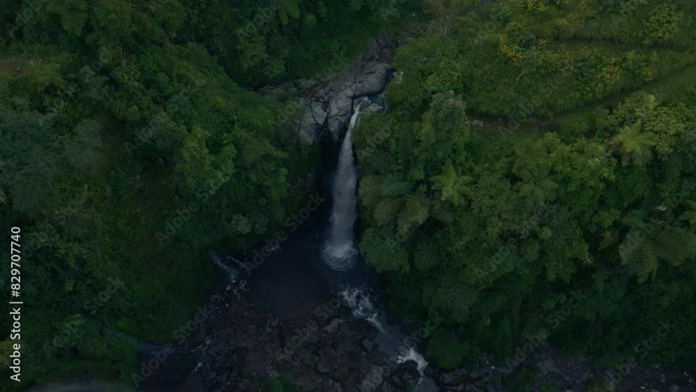 Aerial view of Kedung Kayang Waterfall, the hidden gem of Magelang, Indonesia. Aerial view of Kedung Kayang Waterfall, the hidden gem of Magelang, Indonesia.