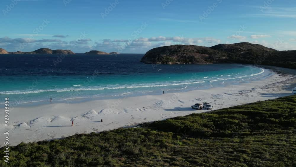 People walking along Lucky Bay beach, Cape Le Grand National Park, Western Australia. Aerial drone panoramic view and slow-motion. Sky for copy space People walking along Lucky Bay beach, Cape Le Grand National Park, Western Australia. Aerial drone panoramic view and slow-motion. Sky for copy space