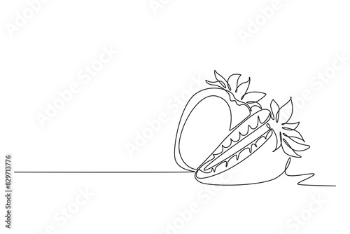 Single one line drawing whole and sliced healthy organic strawberry for orchard logo identity. Fresh berry concept for fruit garden icon. Modern continuous line draw design graphic vector illustration