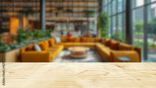 Wooden table with a background of a blurred modern office  offering a picturesque setting for office product displays.