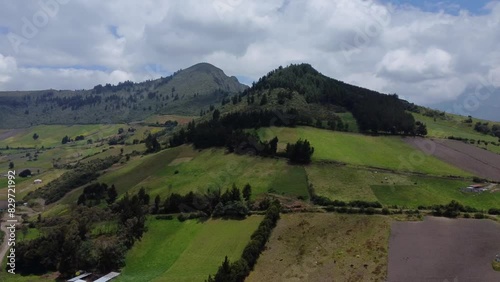 Aerial Drone Tracking Forested Peak With Farms And Fields Below. Cerro Santa Cruz, EL chaupi Parish, Pichincha province, Ecuador.