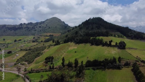 Aerial Drone Flyover Push Of Farms And Forested Mountain Peaks. Cerro Santa Cruz, EL chaupi Parish, Pichincha province, Ecuador.