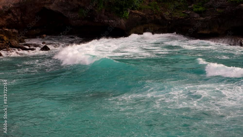 Turquoise Ocean With Splashing Waves In Blue Lagoon Nusa Ceningan, Lembongan, Bali Indonesia. Slow Motion Shot Turquoise Ocean With Splashing Waves In Blue Lagoon Nusa Ceningan, Lembongan, Bali Indonesia. Slow Motion Shot