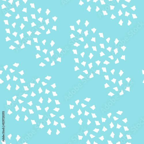 Seamless summer pattern with white spots on a blue background