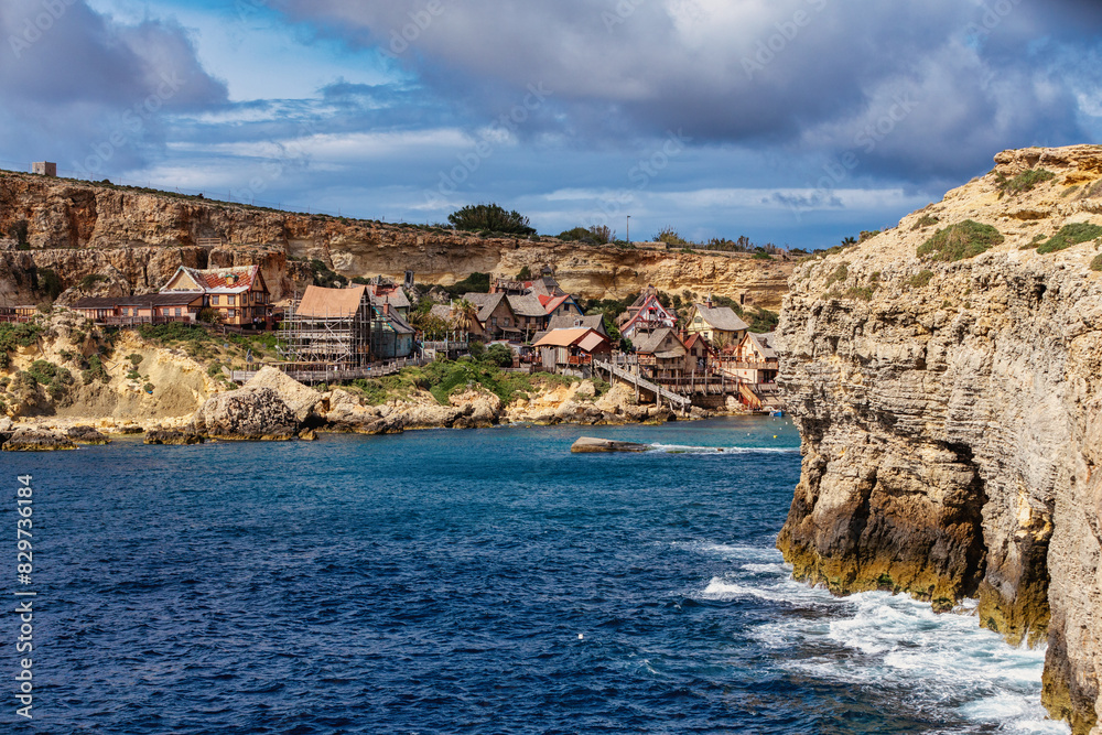 Whimsical Popeye Village in Malta, a film set turned attraction, with its quirky architecture and waterfront charm. Whimsical Popeye Village in Malta, a film set turned attraction, with its quirky architecture and waterfront charm.