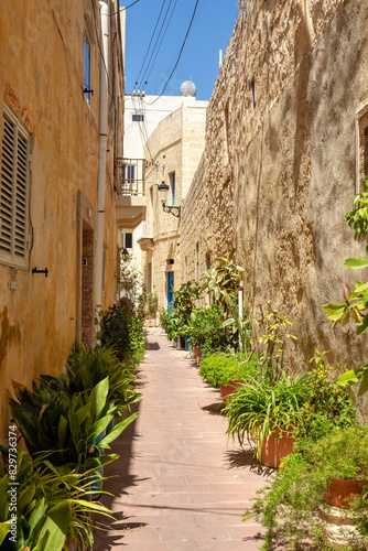 Narrow, winding alleyway in Rabat's ancient core reveals historic sandstone facades and glimpses of Malta's storied past. Rabat, Cultural heritage of Malta,