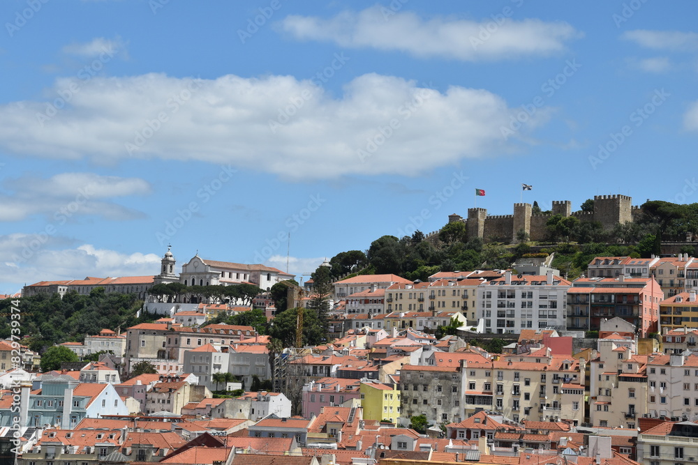Fototapeta premium Aerial view of buildings and landmarks in Lisbon Portugal with incredible architecture and a blue sky background. 
