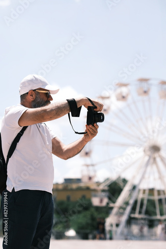 Tirana, Albania - 25 May 2024: photographer shooting at Skanderbeg square.