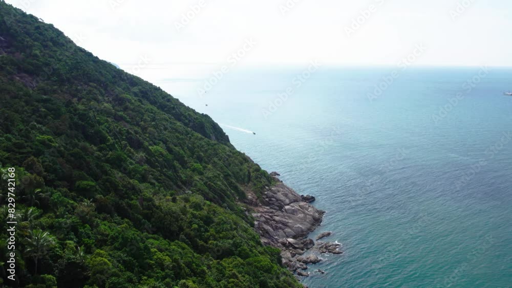 Fly along the seacoast of Koh Phangan, view of sea, greenery, boats