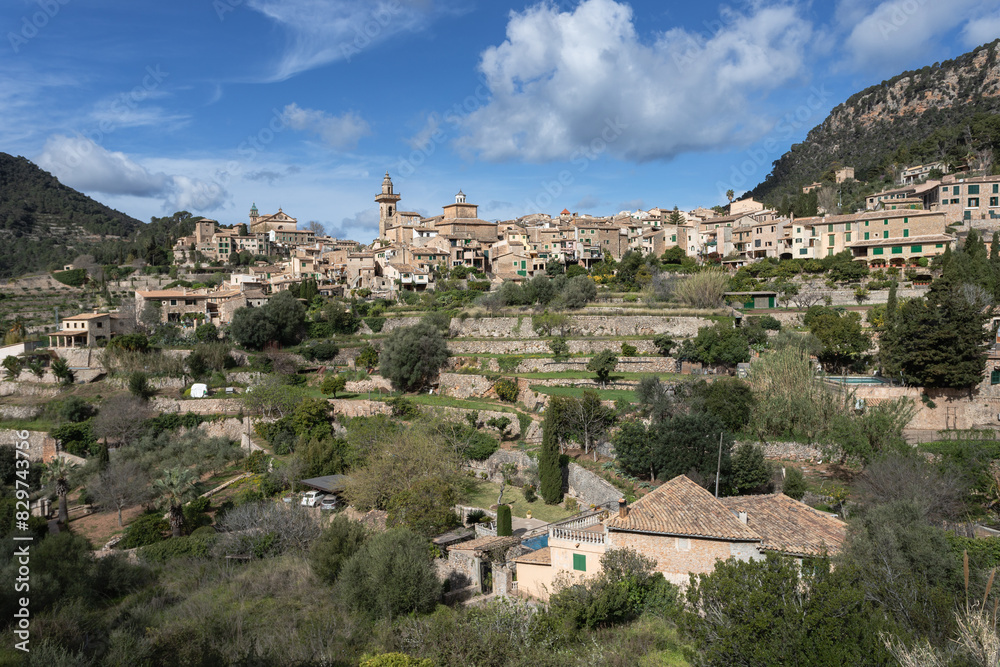 Scenic Valldemossa Town in Palma de Mallorca under a cloudy blue sky Scenic Valldemossa Town in Palma de Mallorca under a cloudy blue sky
