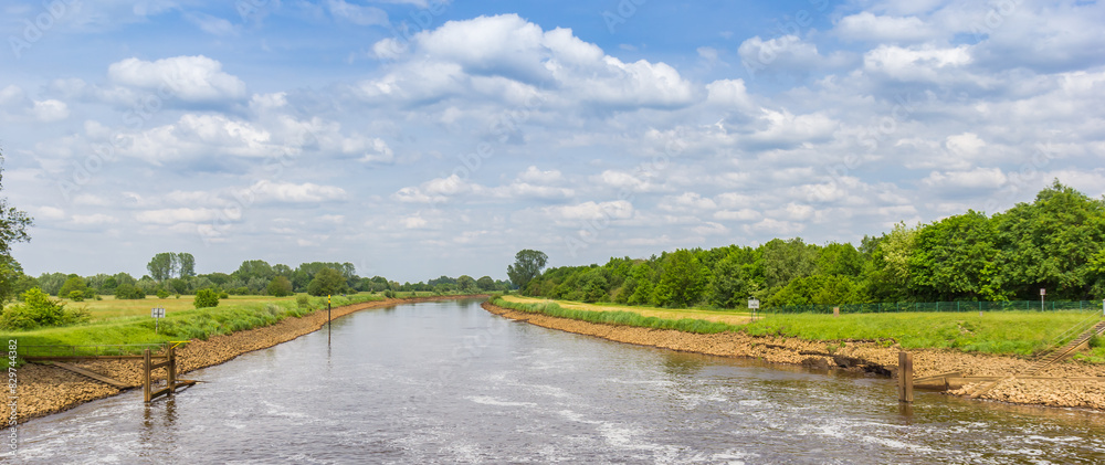 Panorama of a cascade flowing into the Ems river near Papenburg, Germany Panorama of a cascade flowing into the Ems river near Papenburg, Germany