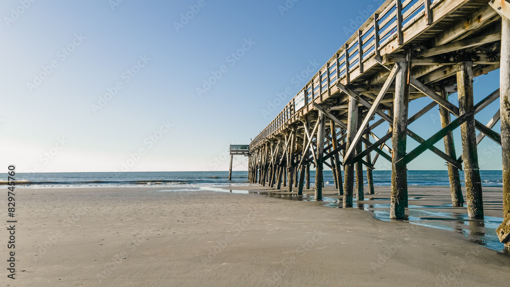 Beautiful view of wooden pier on Isle of Palms beach, Charleston Beautiful view of wooden pier on Isle of Palms beach, Charleston