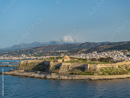 Bustling coastline with a fortress photo