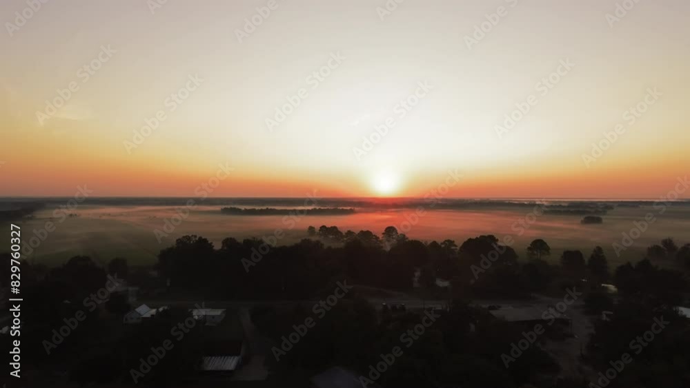 Aerial Forward Beautiful Shot Of Houses Amidst Trees On Tranquil Landscape Against Orange Sky At Sunset - Bayou Vista, Texas Aerial Forward Beautiful Shot Of Houses Amidst Trees On Tranquil Landscape Against Orange Sky At Sunset - Bayou Vista, Texas