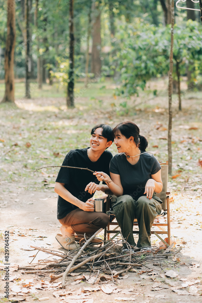 Asian couple sweet in tent inside on they camping trip, traveller relax and sleep togather in out door and camping trip Asian couple sweet in tent inside on they camping trip, traveller relax and sleep togather in out door and camping trip