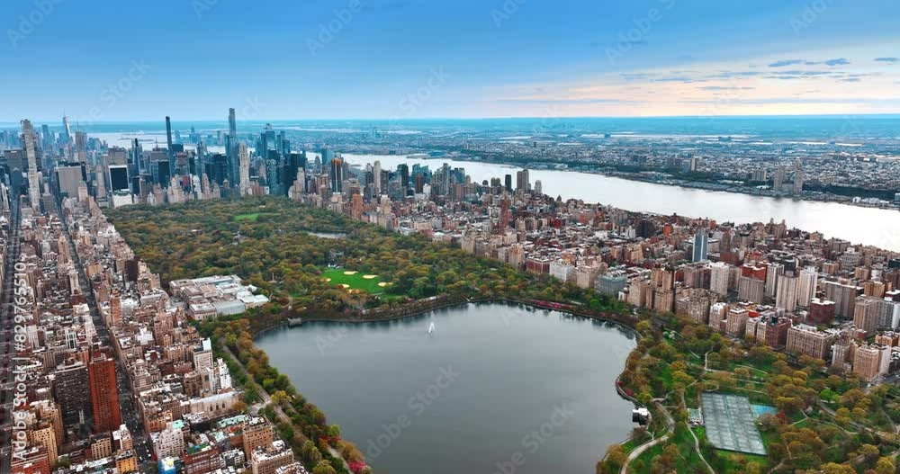 Scenic view of the Central Park in New York at daytime. Densely built panorama of the metropolis from aerial perspective. Scenic view of the Central Park in New York at daytime. Densely built panorama of the metropolis from aerial perspective.