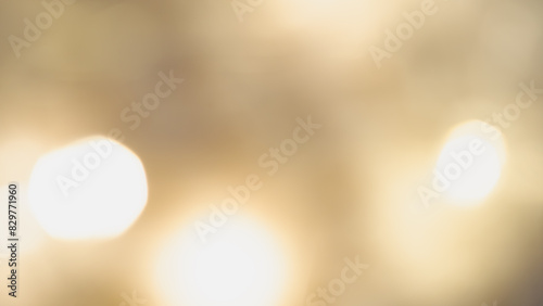 Golden bokeh background with soft, shimmering lights creating a warm ambiance. © Наталья Добровольска