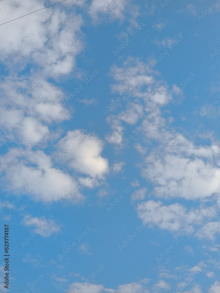 view of white clouds in a clear blue sky view of white clouds in a clear blue sky
