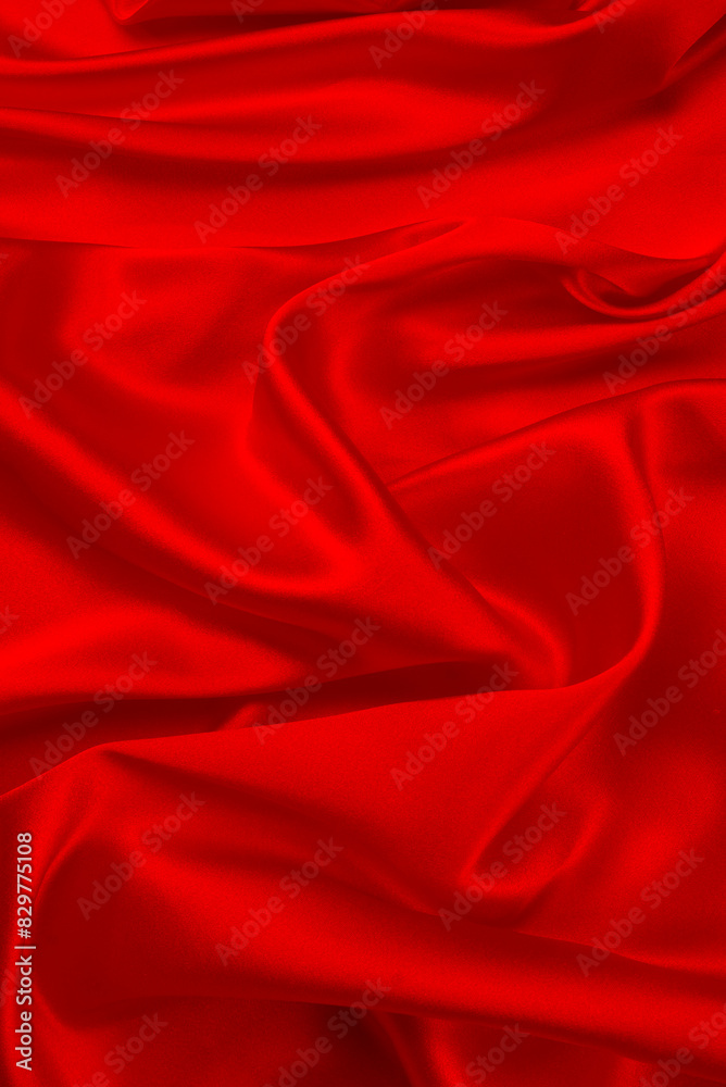 Red silk or satin luxury fabric texture can use as abstract background. Top view. Red silk or satin luxury fabric texture can use as abstract background. Top view.