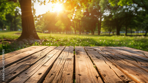 Empty wooden table in park on sunny day.