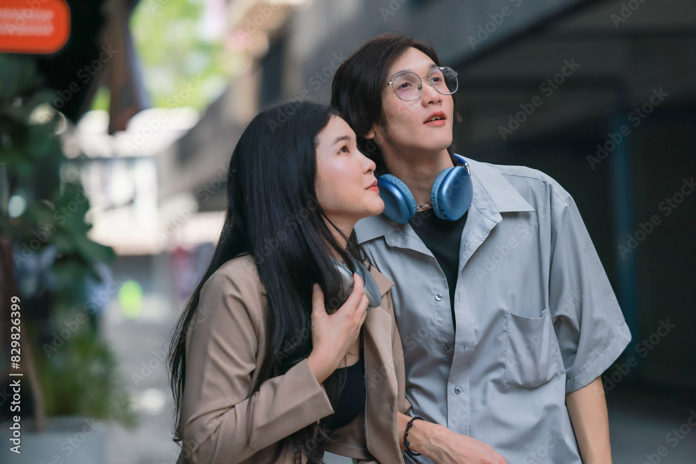 Asian couples playfully bond, sharing affectionate gazes, laughter, and intimate warmth outdoors. Asian couples playfully bond, sharing affectionate gazes, laughter, and intimate warmth outdoors.