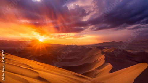 The golden sunlight shines on the sand dunes in the desert landscape