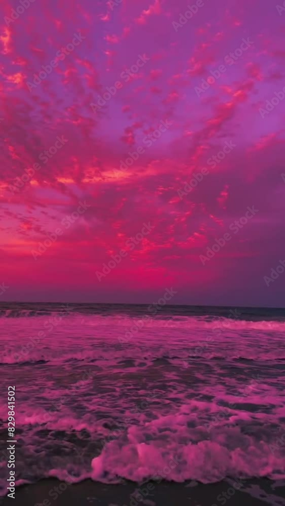 waves crashing on the beach with a purple sky, suitable for introverts