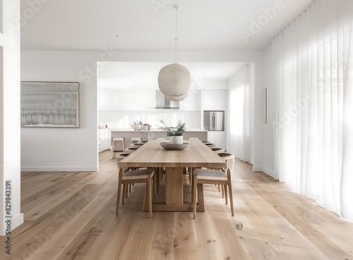 Front view of a dining room in a modern Australian home with white walls and a light wood floor, 