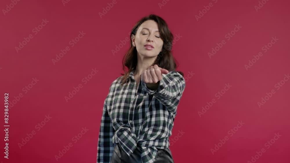 Mid aged woman asks join, beckons with inviting hand gesture. Hey you, come on Mid aged woman asks join, beckons with inviting hand gesture. Hey you, come on