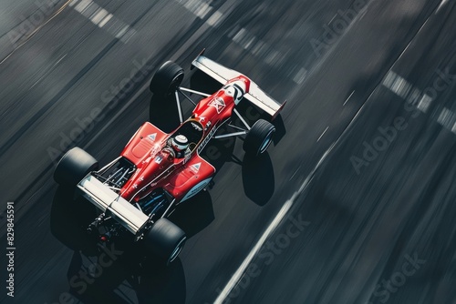 Race car driving fast on the track, view from above