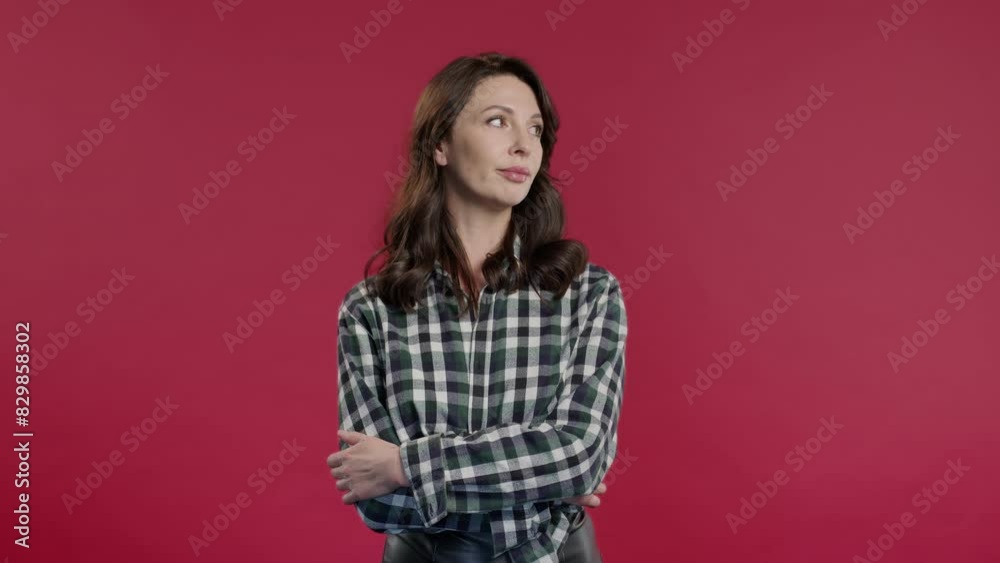 Bored upset woman sighs, rolling eyes on red backdrop. Mature lady, displeasure Bored upset woman sighs, rolling eyes on red backdrop. Mature lady, displeasure