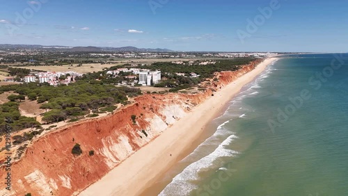 View of the Praia da Falesia with its unique multicolored cliffs, Algarve region photo
