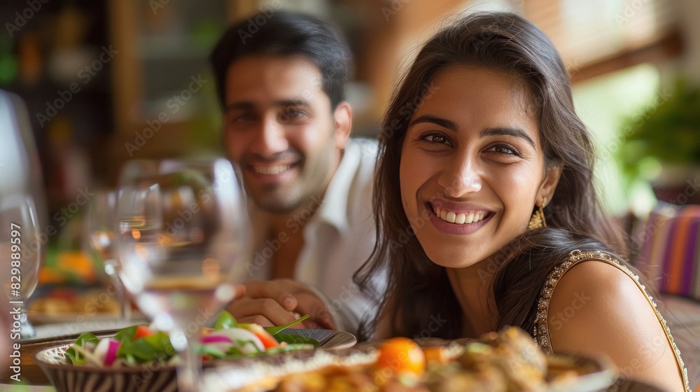 young indian couple eating food at restaurant young indian couple eating food at restaurant