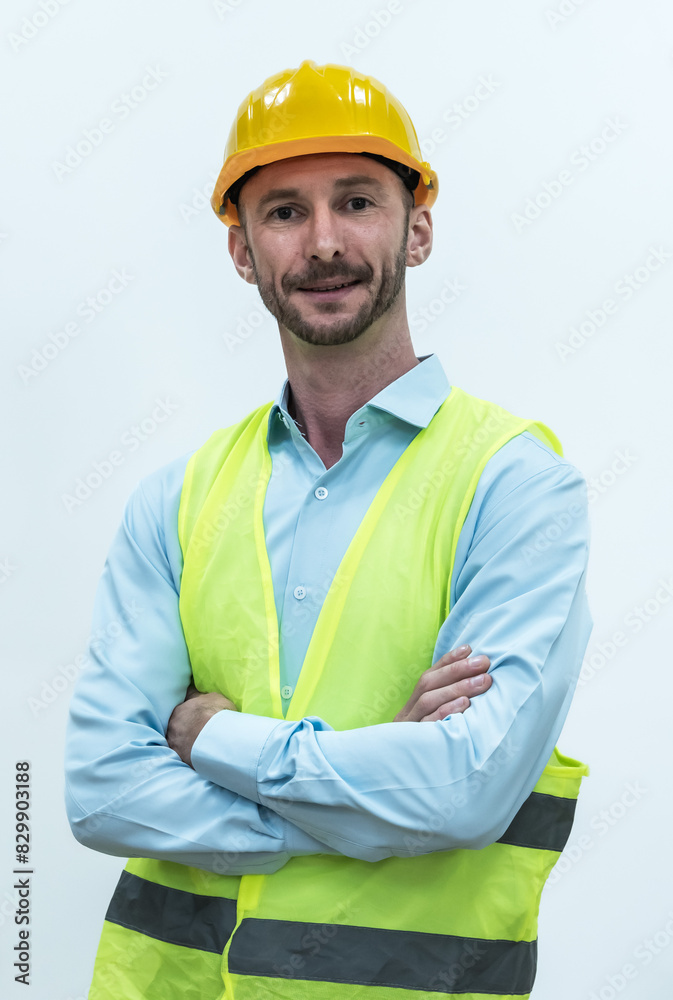 Portrait young Caucasian engineer man with safety helmet and vest on white background Portrait young Caucasian engineer man with safety helmet and vest on white background