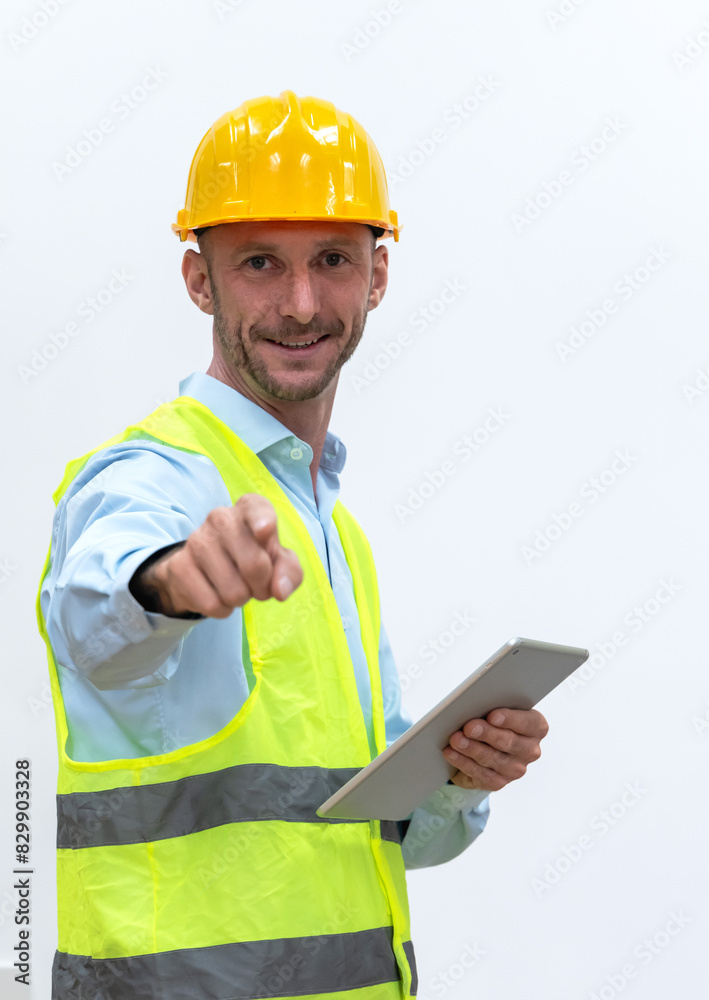 Portrait young Caucasian engineer man with safety helmet and vest on white background