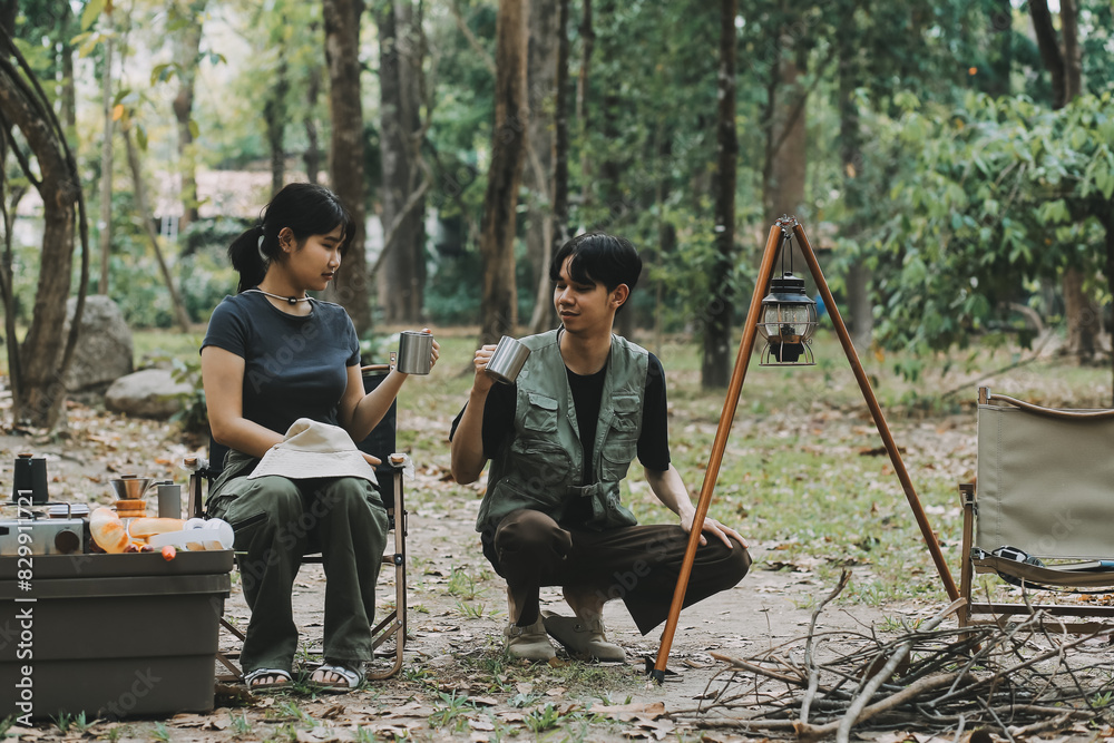 Asian couple sweet in tent inside on they camping trip, traveller relax and sleep togather in out door and camping trip Asian couple sweet in tent inside on they camping trip, traveller relax and sleep togather in out door and camping trip