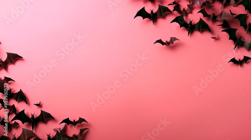 pink background bats on pink halloween background