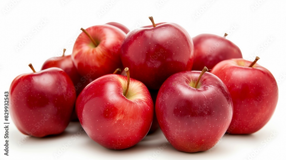 Fresh red apples with stems arranged in a pyramid shape on a clean white background Fresh red apples with stems arranged in a pyramid shape on a clean white background